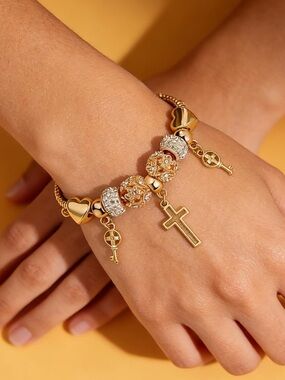 Anthropologie Gold-Tone Charm Bracelet with Cross and Key Drops
